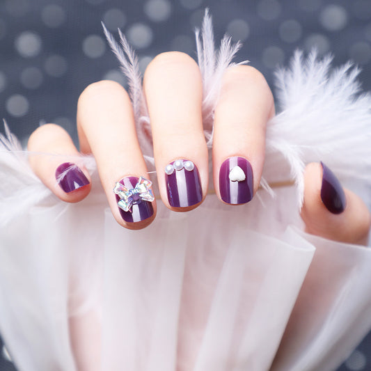 Wearing Nails With Diamonds And Purple Fake Nails - Hot Trends Online